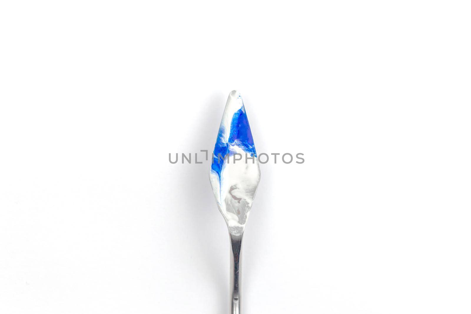a painting palette knife isolated on a white background painting a blue teal with copy space. by lunarts