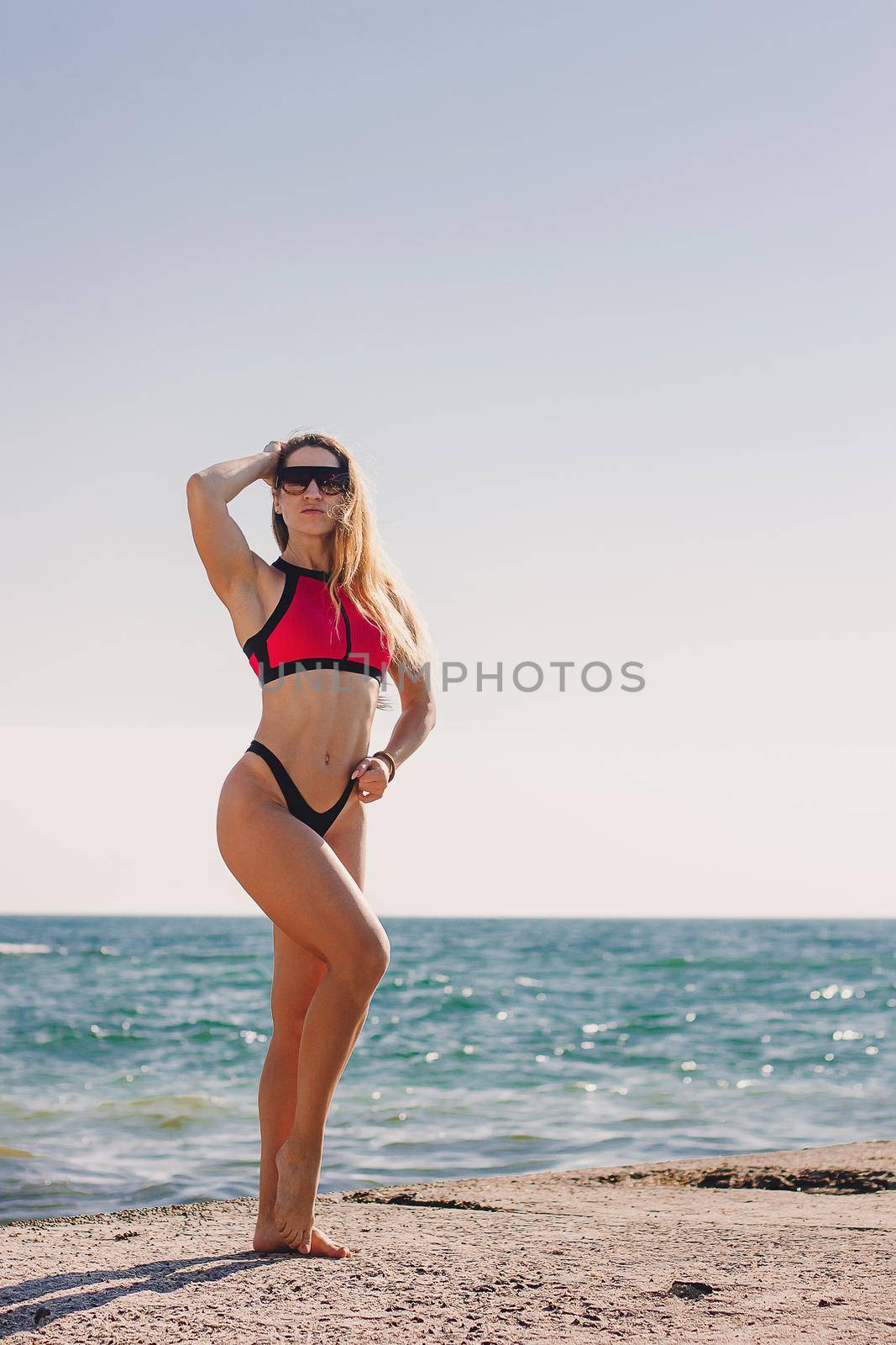 Young healthy lifestyle sport fitness instructor happy woman in bikini on beach. by mmp1206