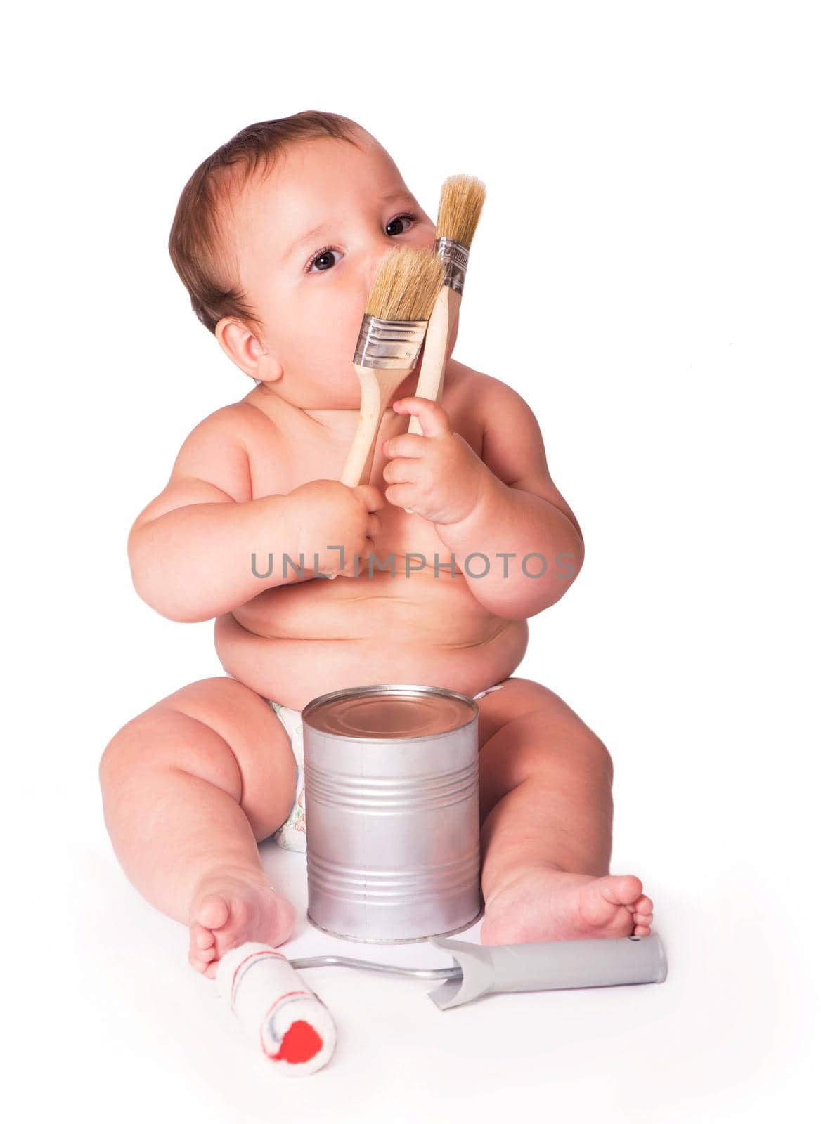boy holding a brush and paint can. Isolated on the white background
