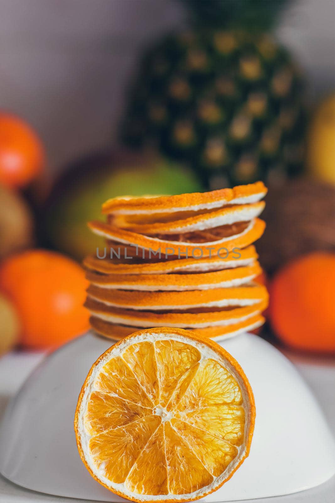 Dried homemade healthy fresh dehydrated slices of fruits. Fruit chips, natural raw vegan organic snack. Healthy food concept.