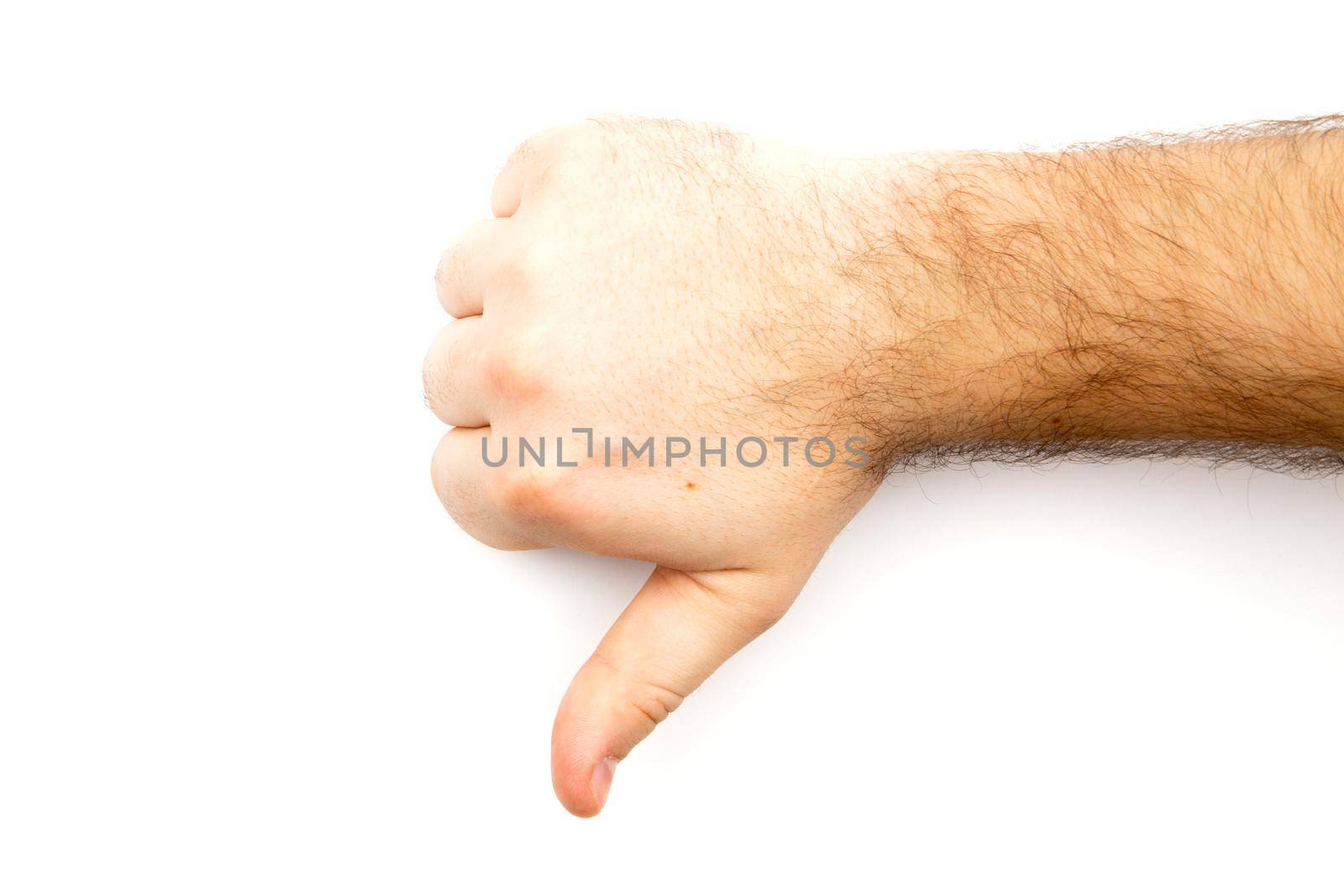 Male hairy hand showing Dislike, unlike, fail, disagree sign, thumb down hand with white background and copy space.