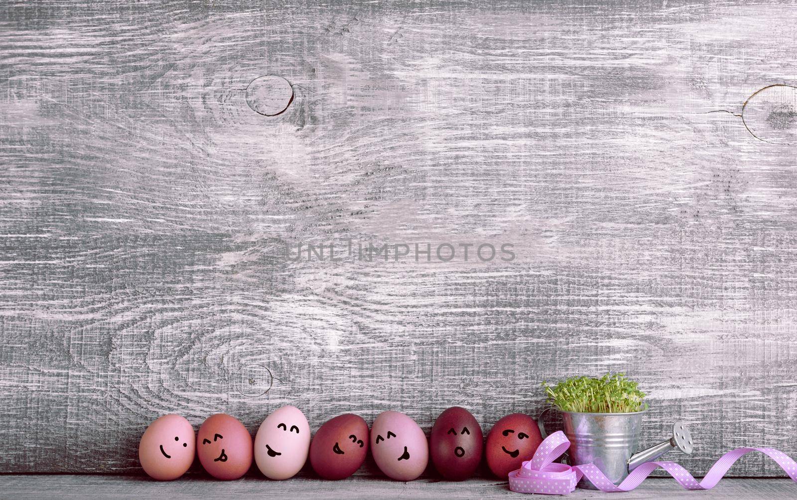 Easter eggs in fashionable colors on a gray wooden background by vvmich