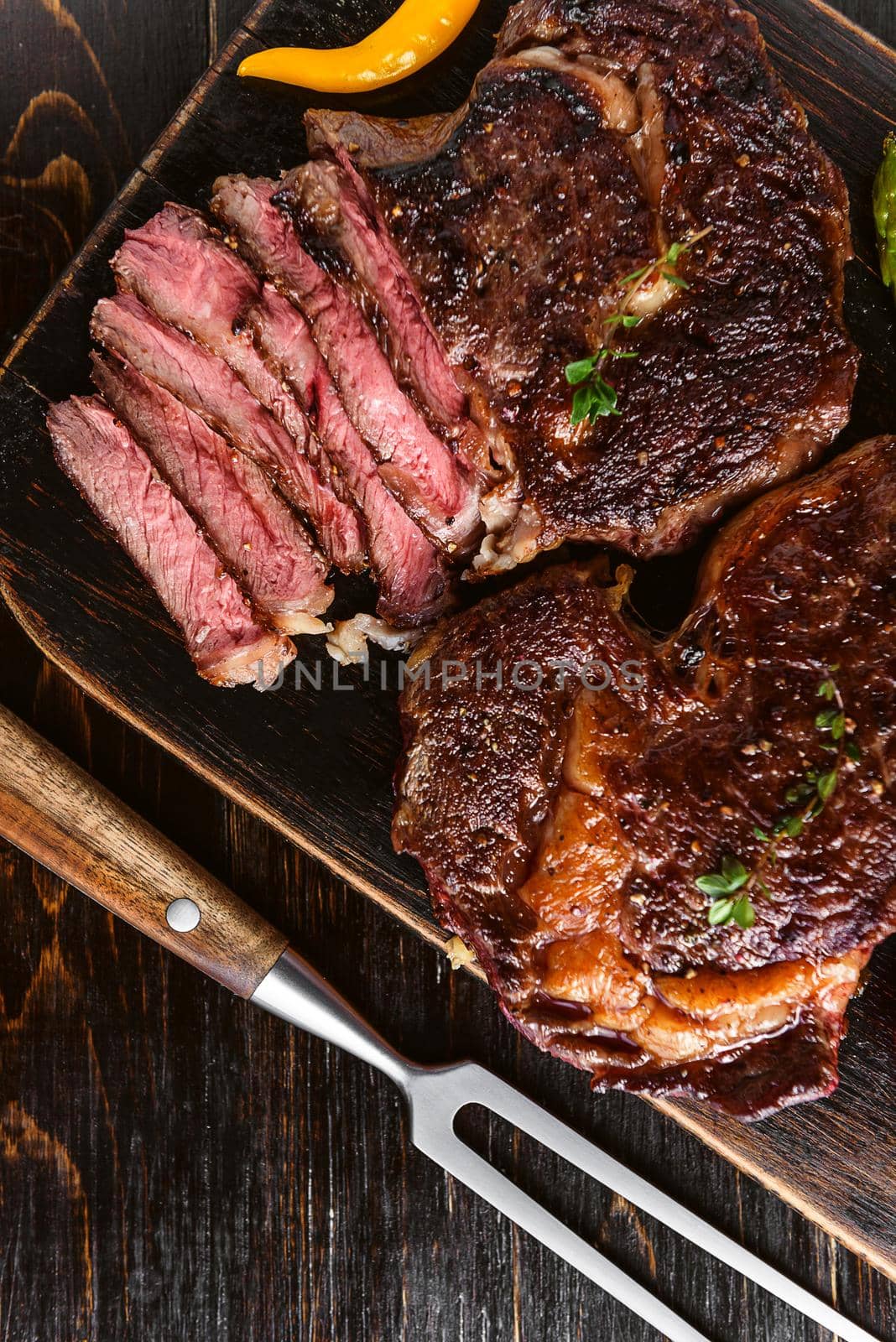 Dinner for two juicy delicious steaks, asparagus with parmesan and vegetables. by vvmich