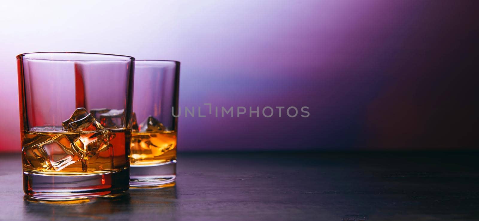 whiskey with ice in modern glasses by vvmich