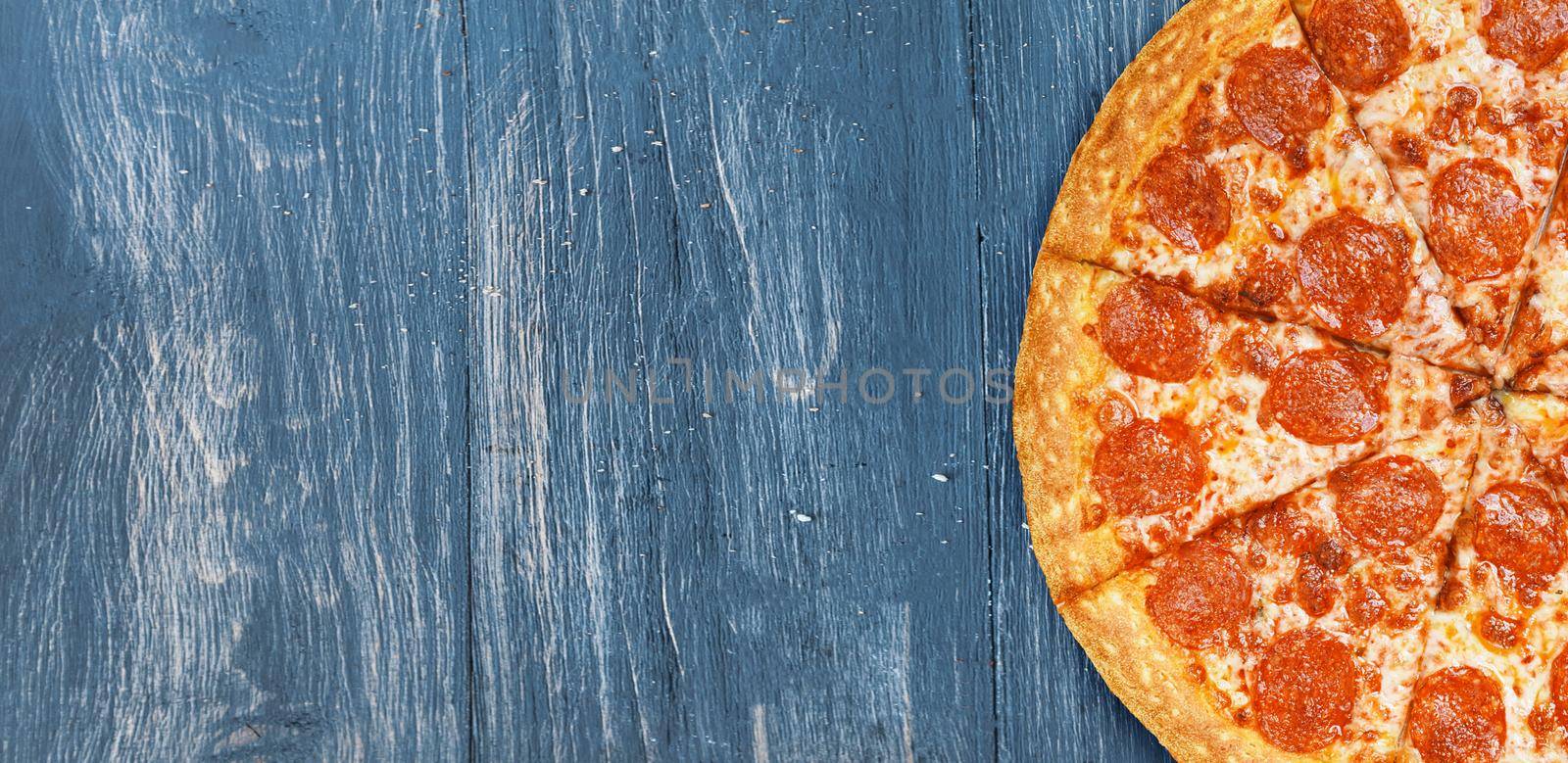 pizza close-up on a wooden surface