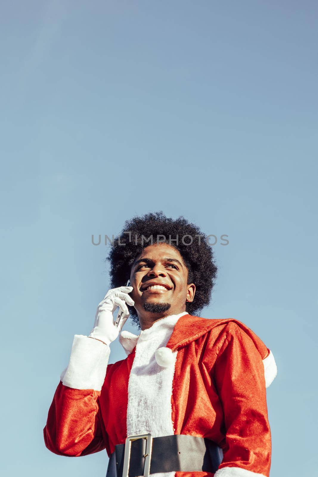 Closeup view of african santa talking on the phone