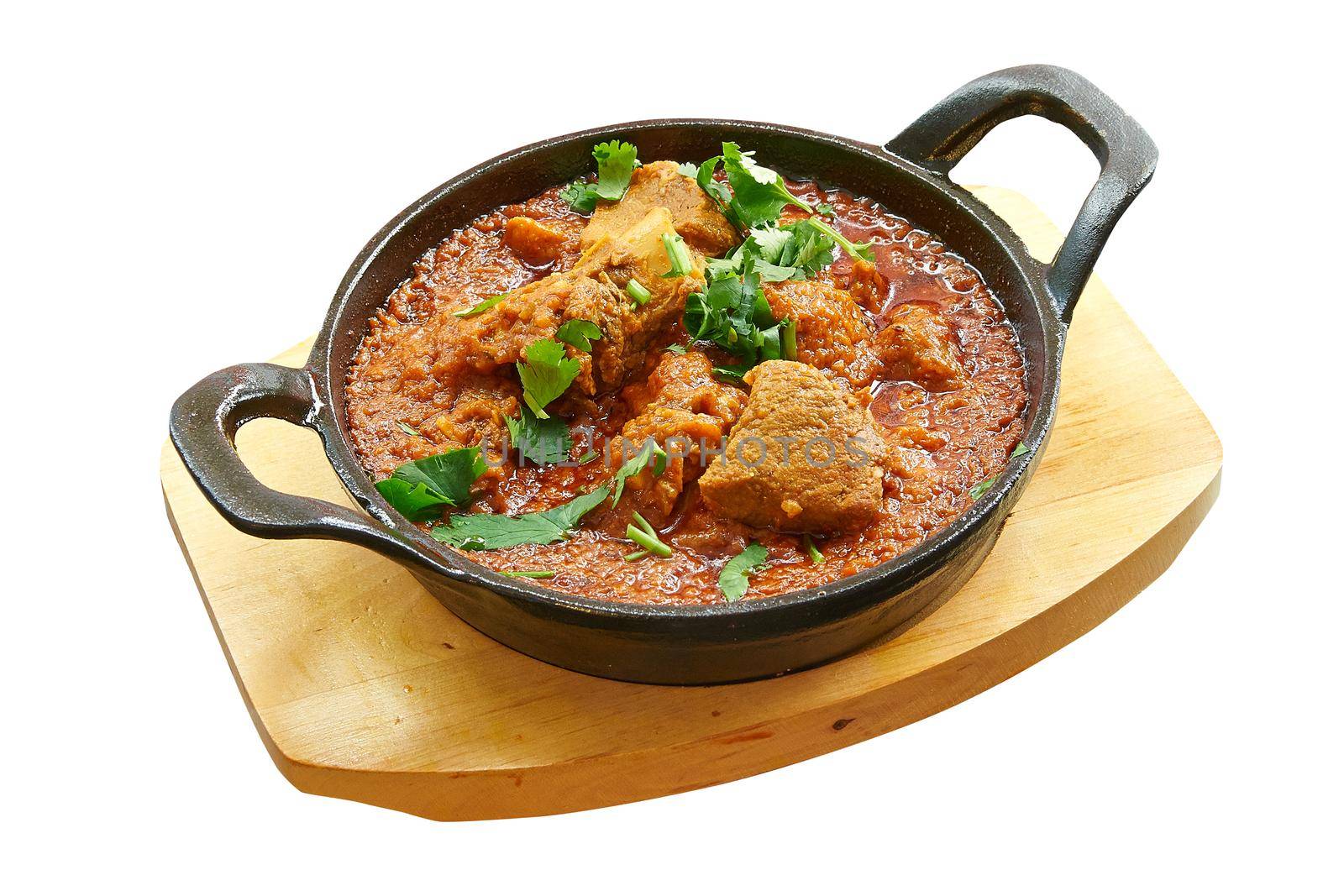 Overhead  shot of lamb karahi baked in little pan. Isolated on white with clipping path