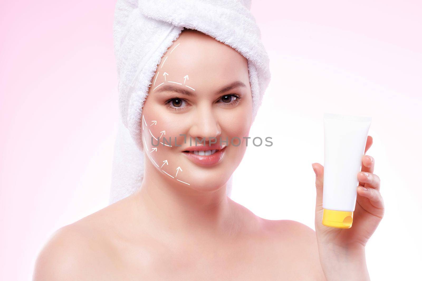 Portrait of attractive woman with arrows on her face skin for cosmetology