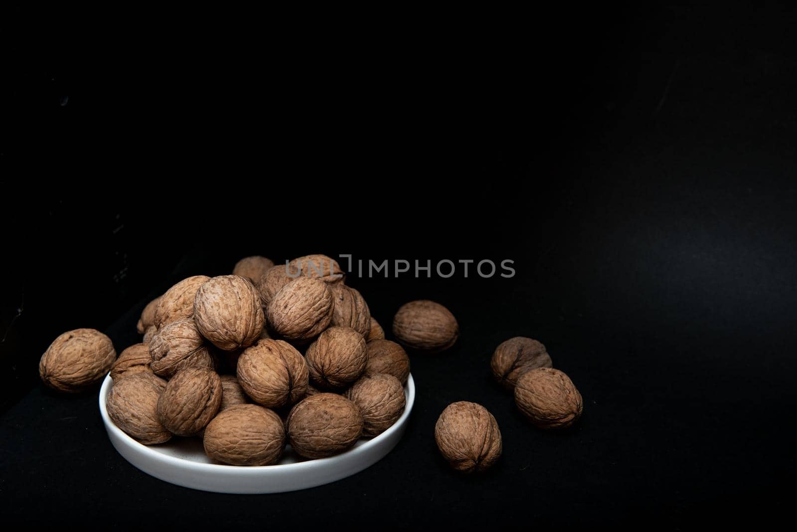 walnut slide on a black background in a low key