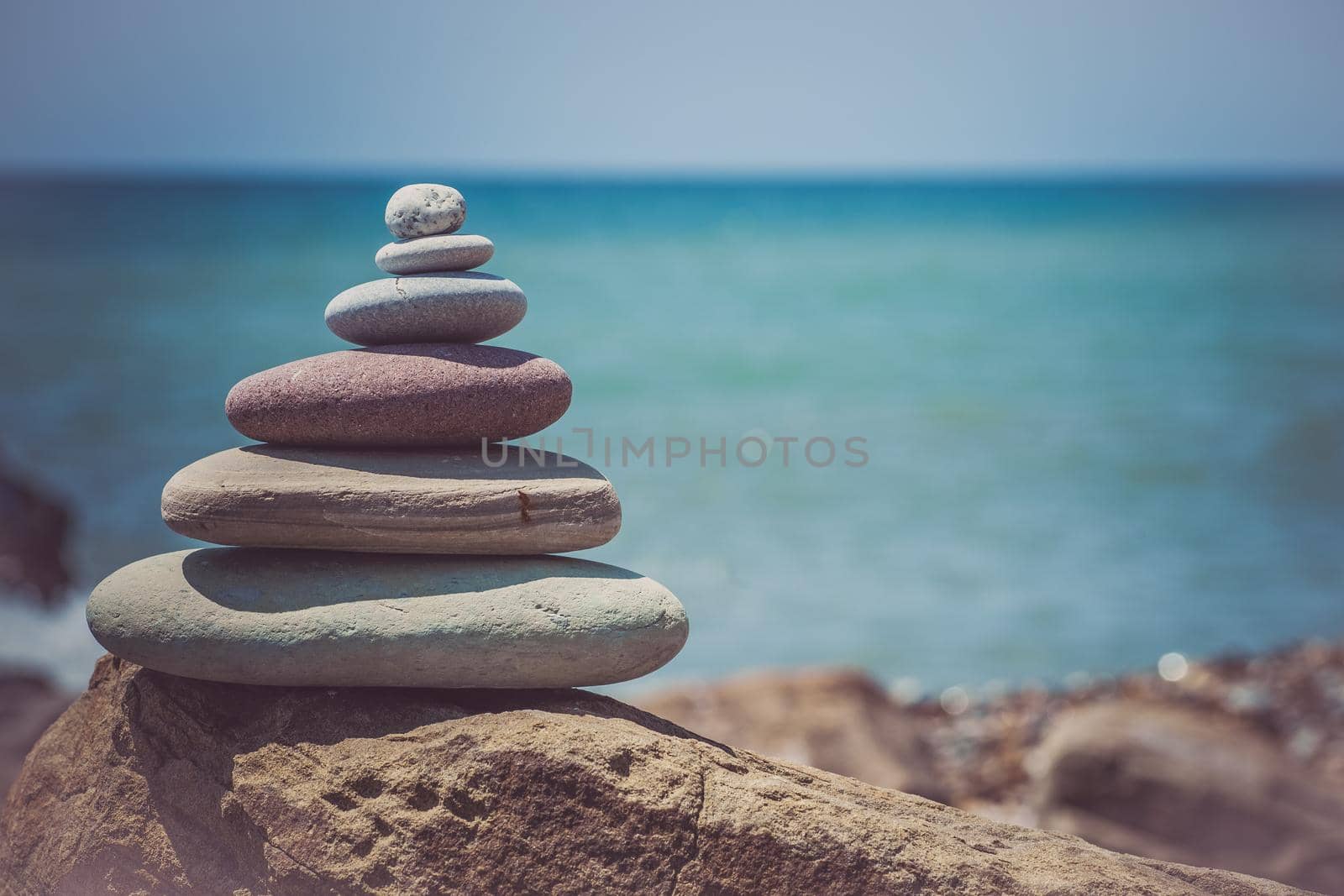 Stack of zen stones near sea. Harmony, balance.
