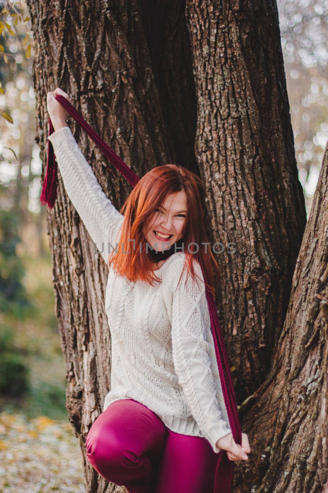 Autumn woman in autumn park. Warm sunny weather. Fall concept.