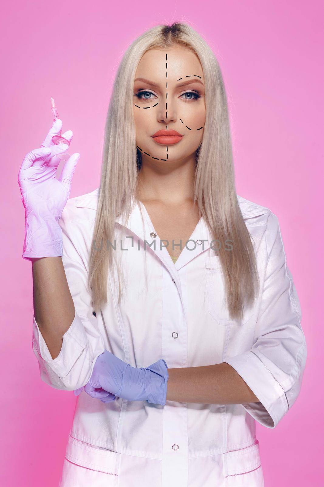 Portrait of attractive woman with arrows on her face skin for cosmetology