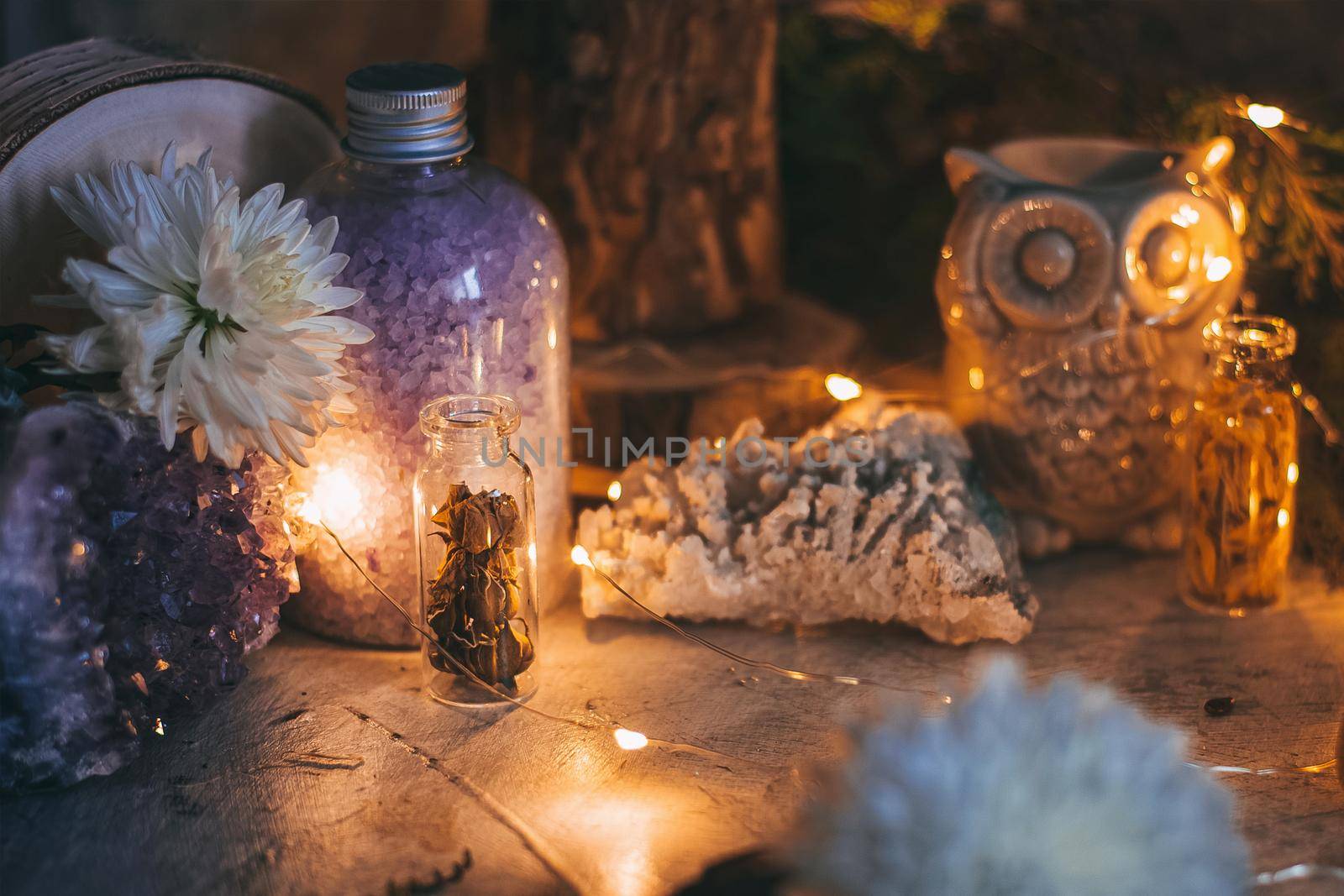 Mysterious halloween scene, witchcraft practicing, ritual candles. Fairytale, fairies theme, gemstones, flowers love magic white magic