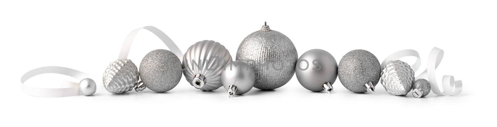 Pile of Christmas baubles isolated on white background, close up