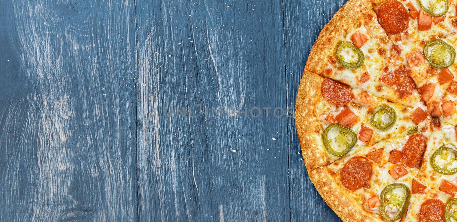 pizza close-up on a wooden surface