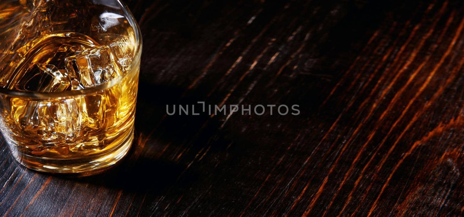 whiskey with ice in modern glasses