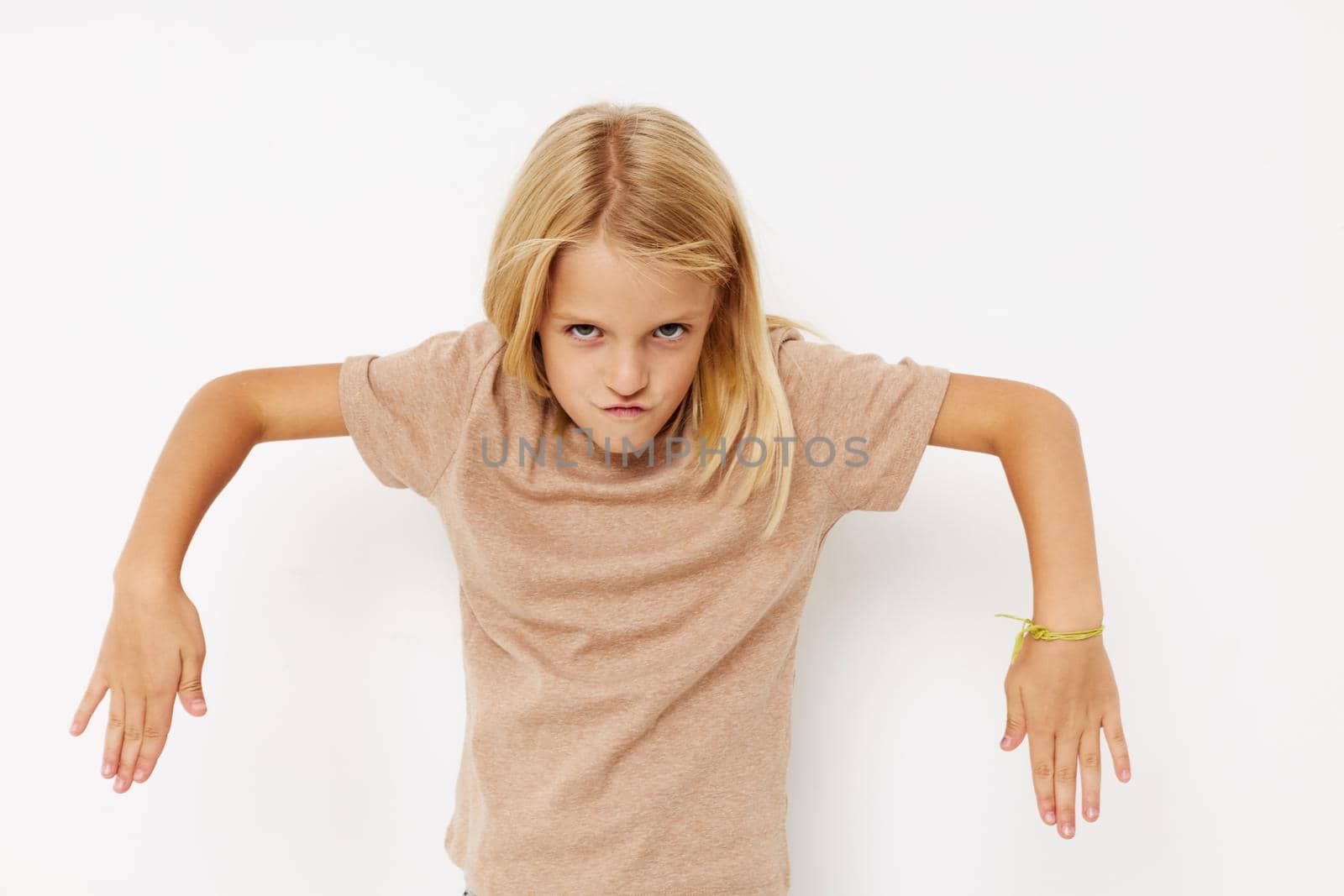 happy cute girl with blond hair posing studio. High quality photo
