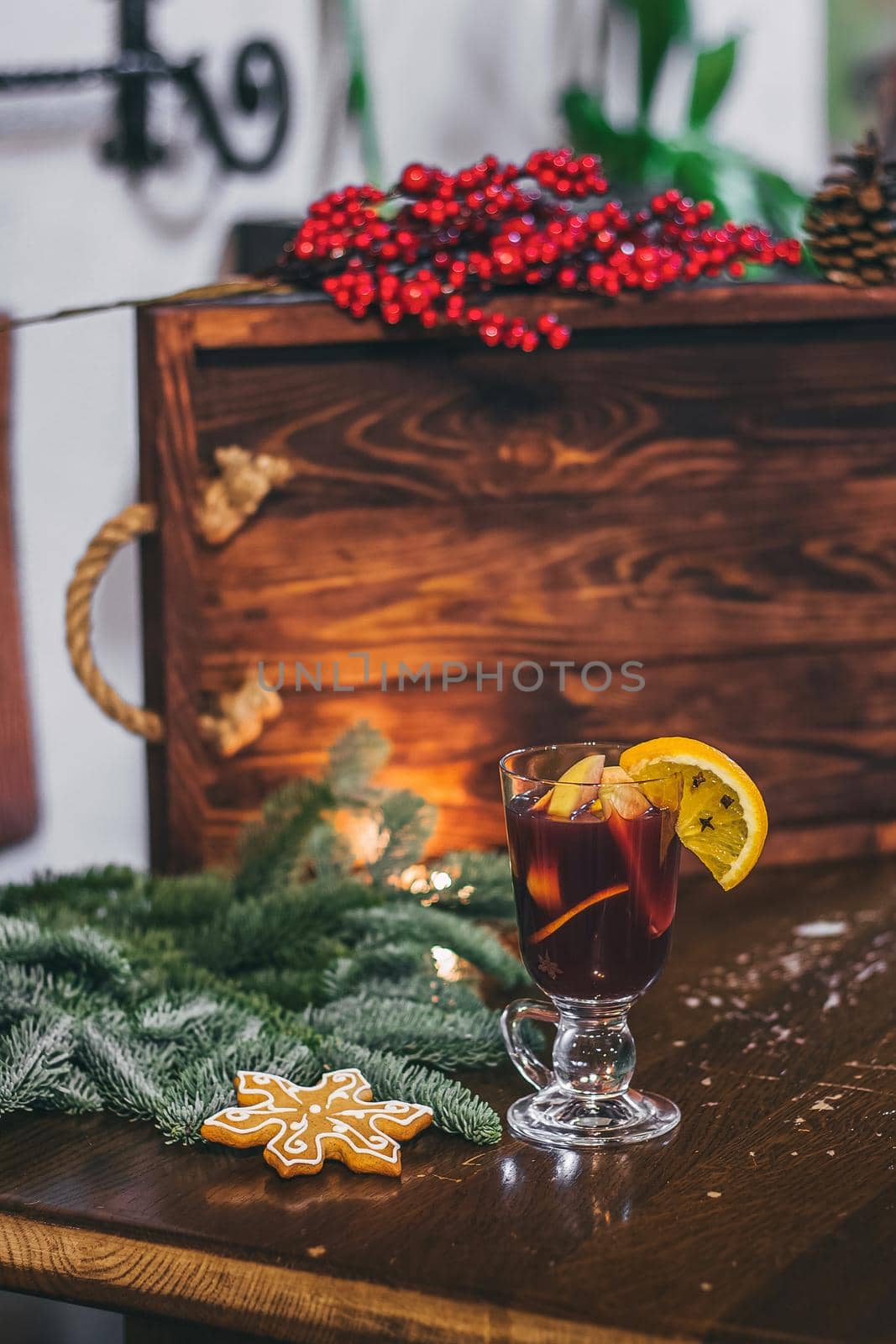 Red hot drink glintwein with spices, cinnamon, anise, fruits, brown sugar on an old wooden table. New Year and Christmas holidays concept. Mulled wine and glintwein. by mmp1206
