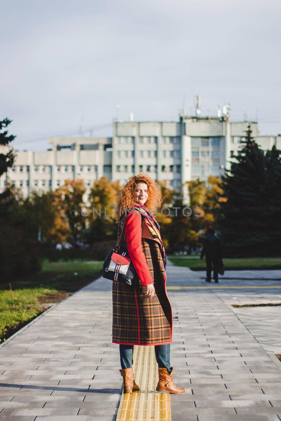 Pregnancy, maternity and happiness. Stylish young pregnant female having rest in park. Beautiful woman expecting baby, enjoying sweet moment outdoors.