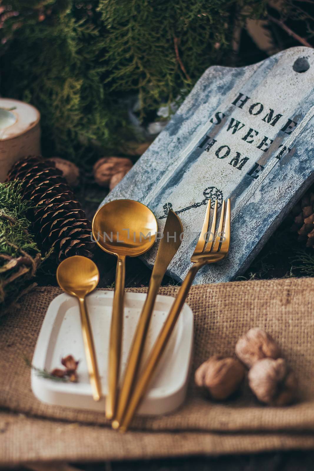 Golden Cutlery Set. Fork, Spoons and Knife in Christmas atmosphere.
