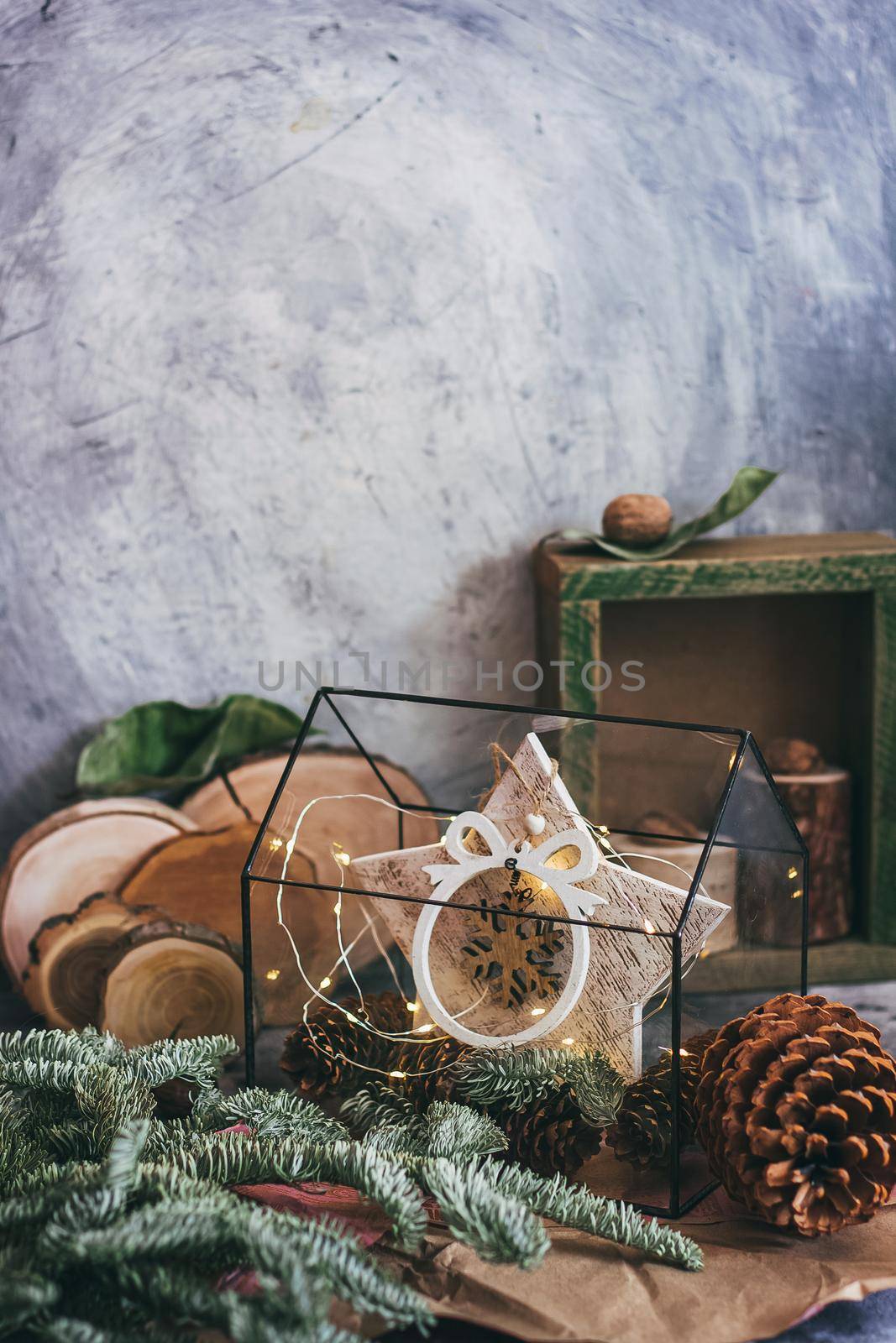 Christmas composition with nuts, garland, star, wooden decor rustic wooden box and fir tree branch. Rustic style. by mmp1206