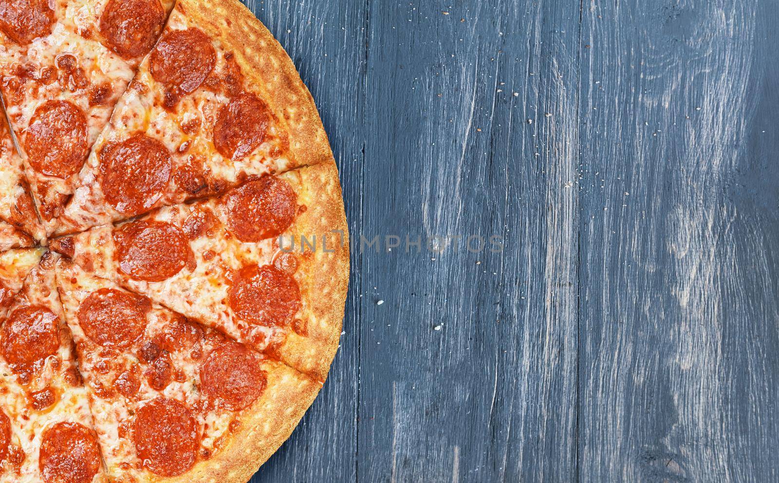 pizza close-up on a wooden surface