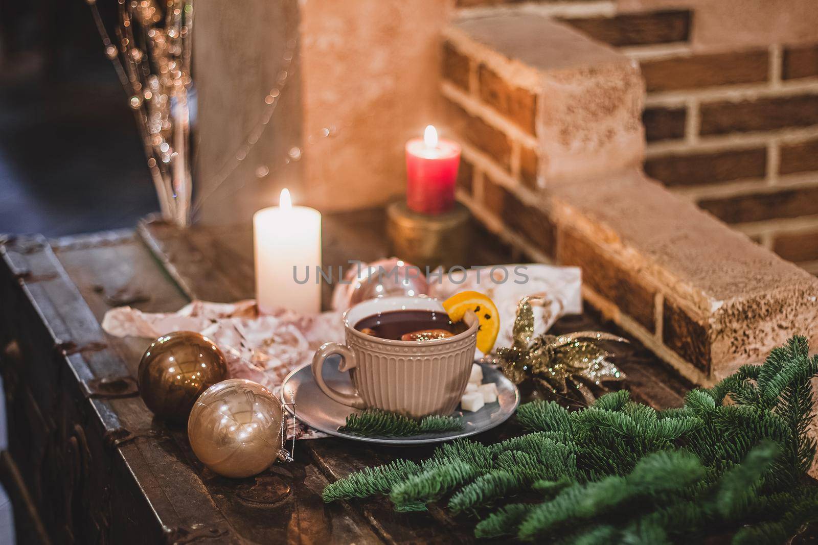 Red hot drink glintwein with spices, cinnamon, anise, fruits, brown sugar on an old wooden table. New Year and Christmas holidays concept. Mulled wine and glintwein. by mmp1206