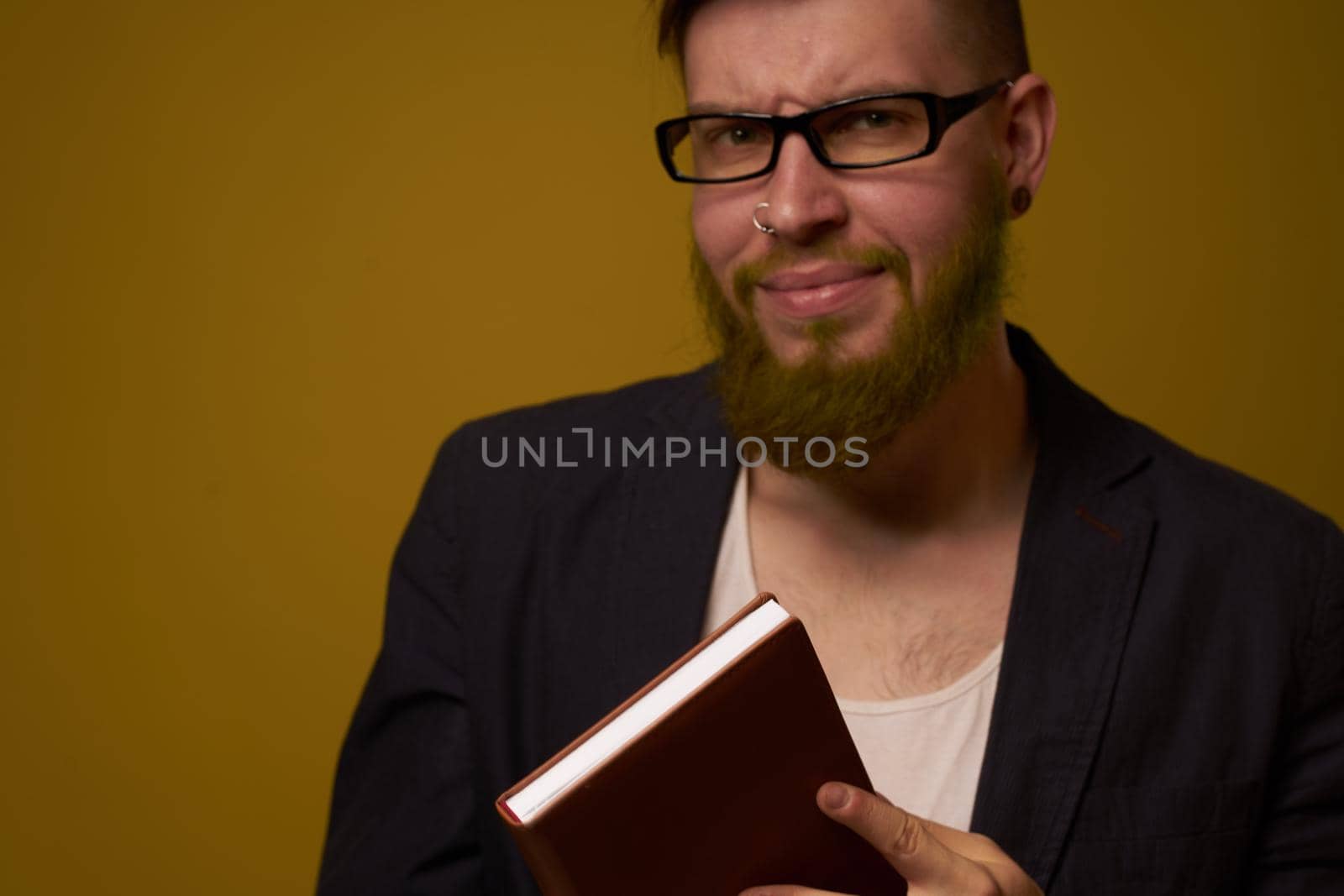 bearded man in a black jacket with a book in his hands education by Vichizh