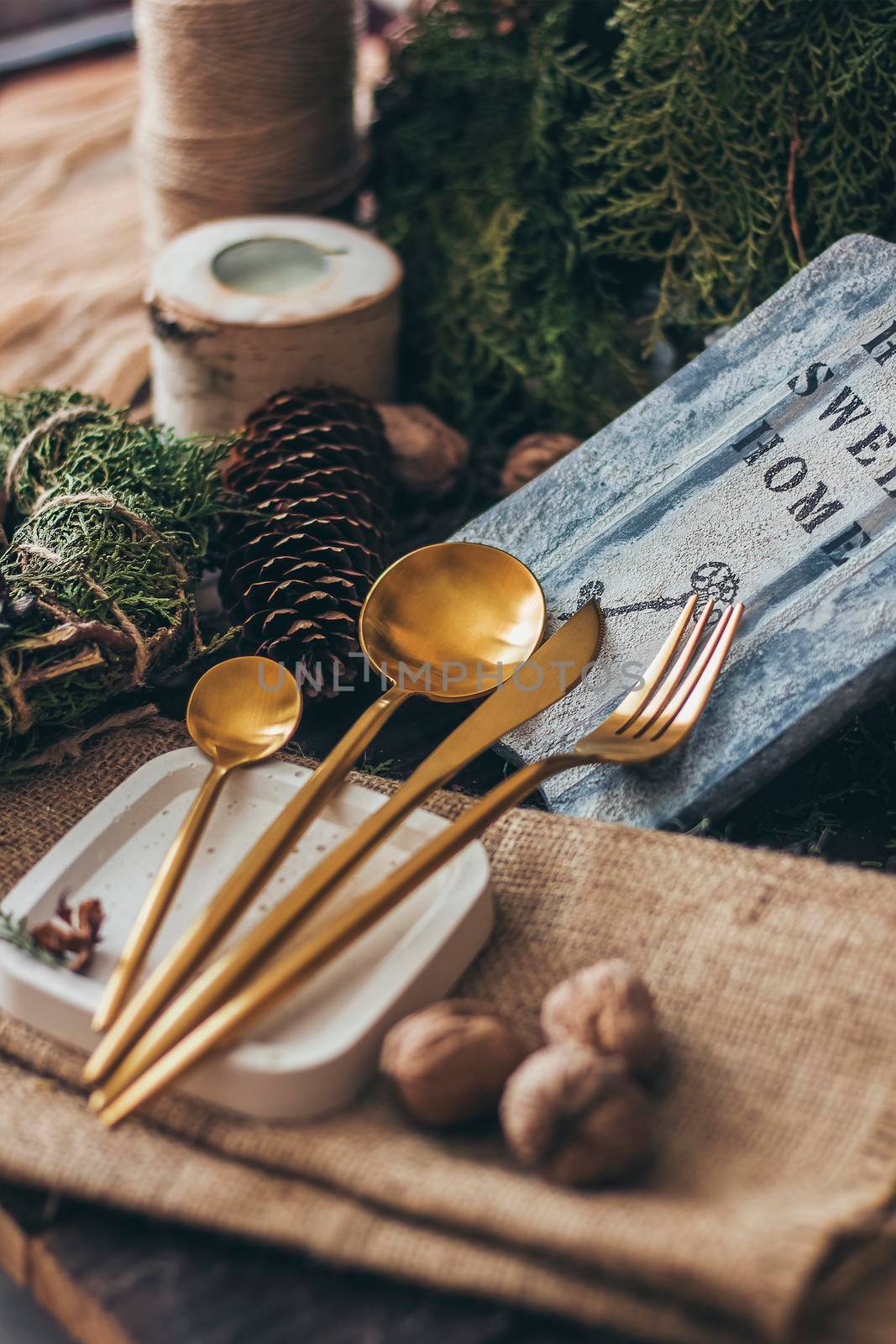 Golden Cutlery Set. Fork, Spoons and Knife in Christmas atmosphere.