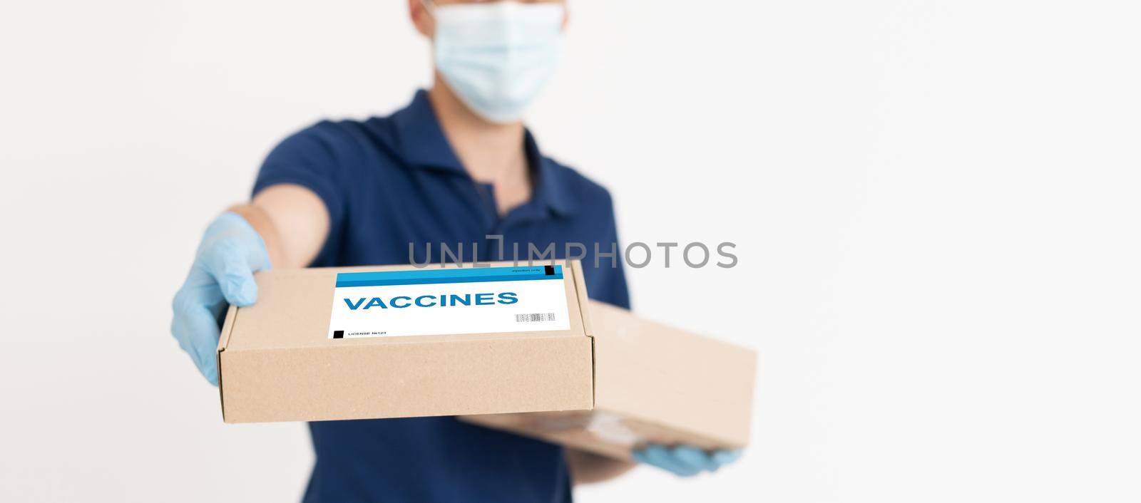 Close up of paper boxes with coronavirus vaccine, copy space, world pandemic, covid-19, quarantine.