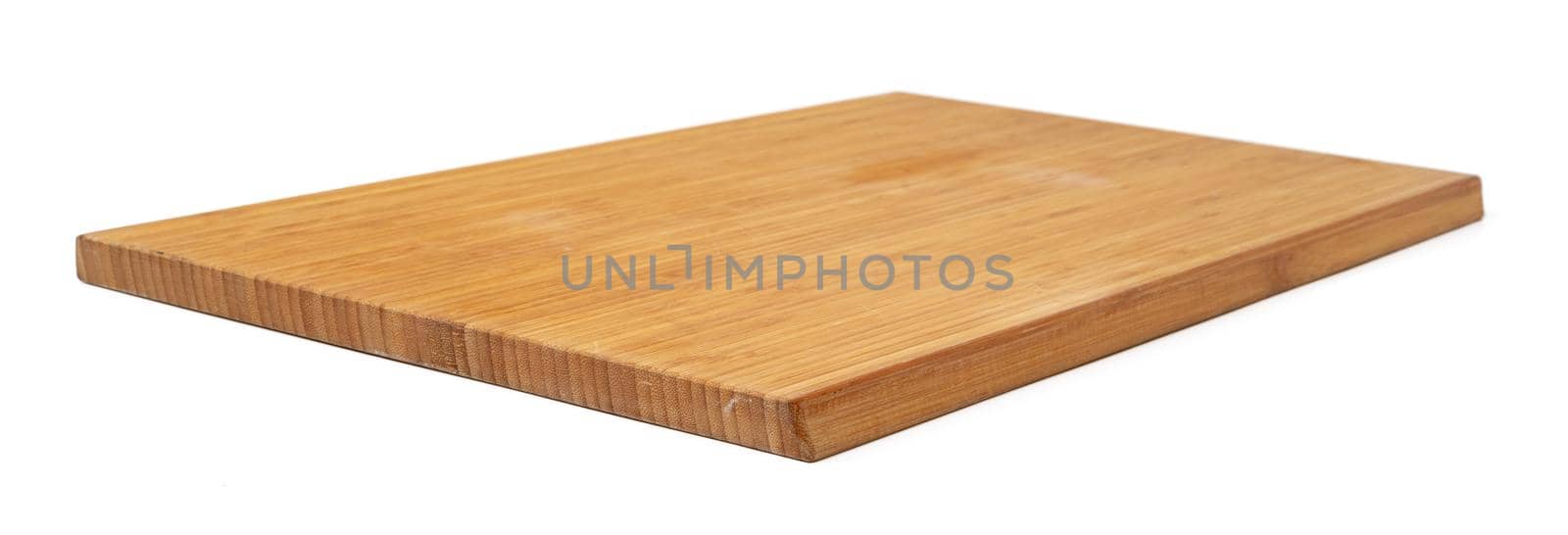 Wooden cutting board on a white background, close up