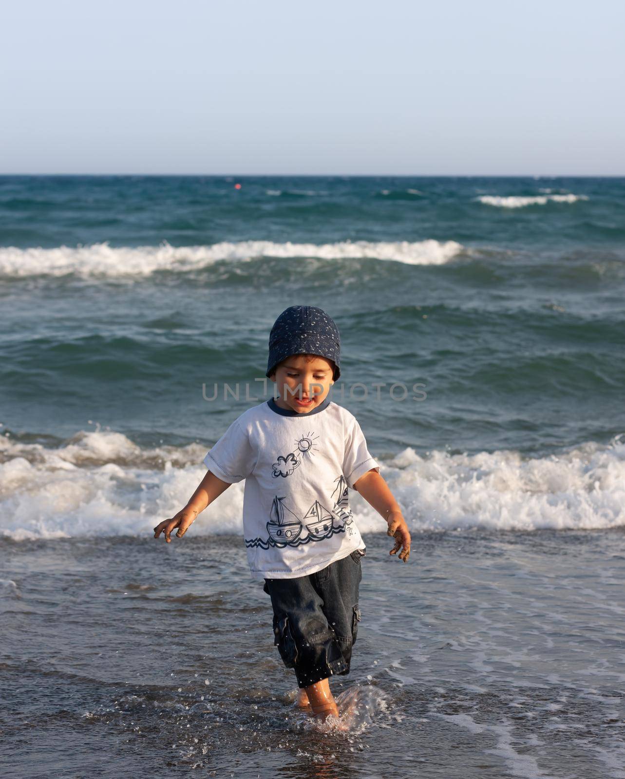 Healthy lifestyle. Boy on seashore by palinchak