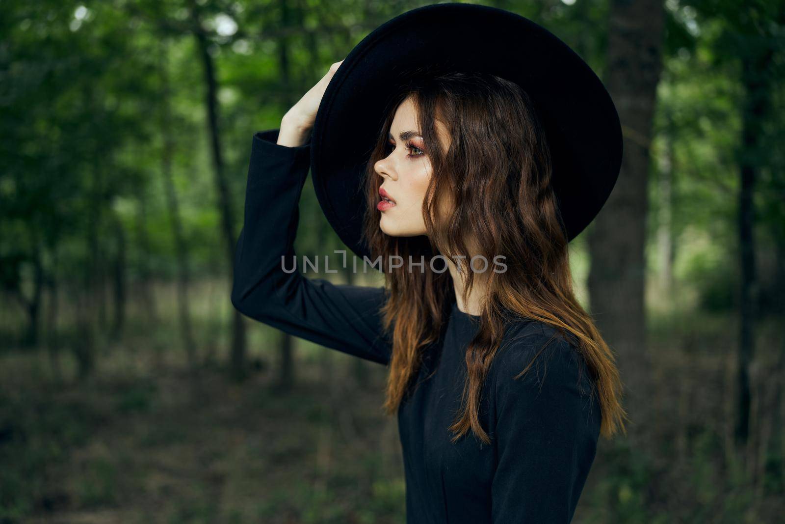 woman witch in black hat in the forest posing fantasy by Vichizh