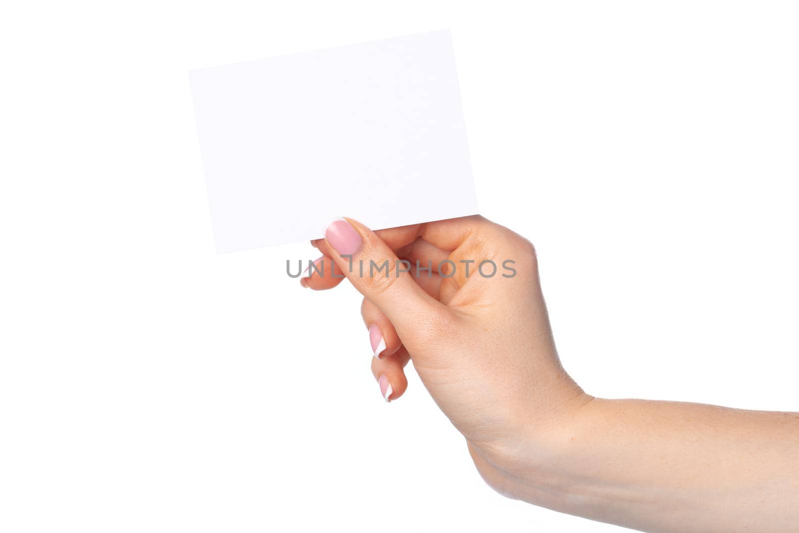 Woman's hand with blank white business card isolated on white by Fabrikasimf