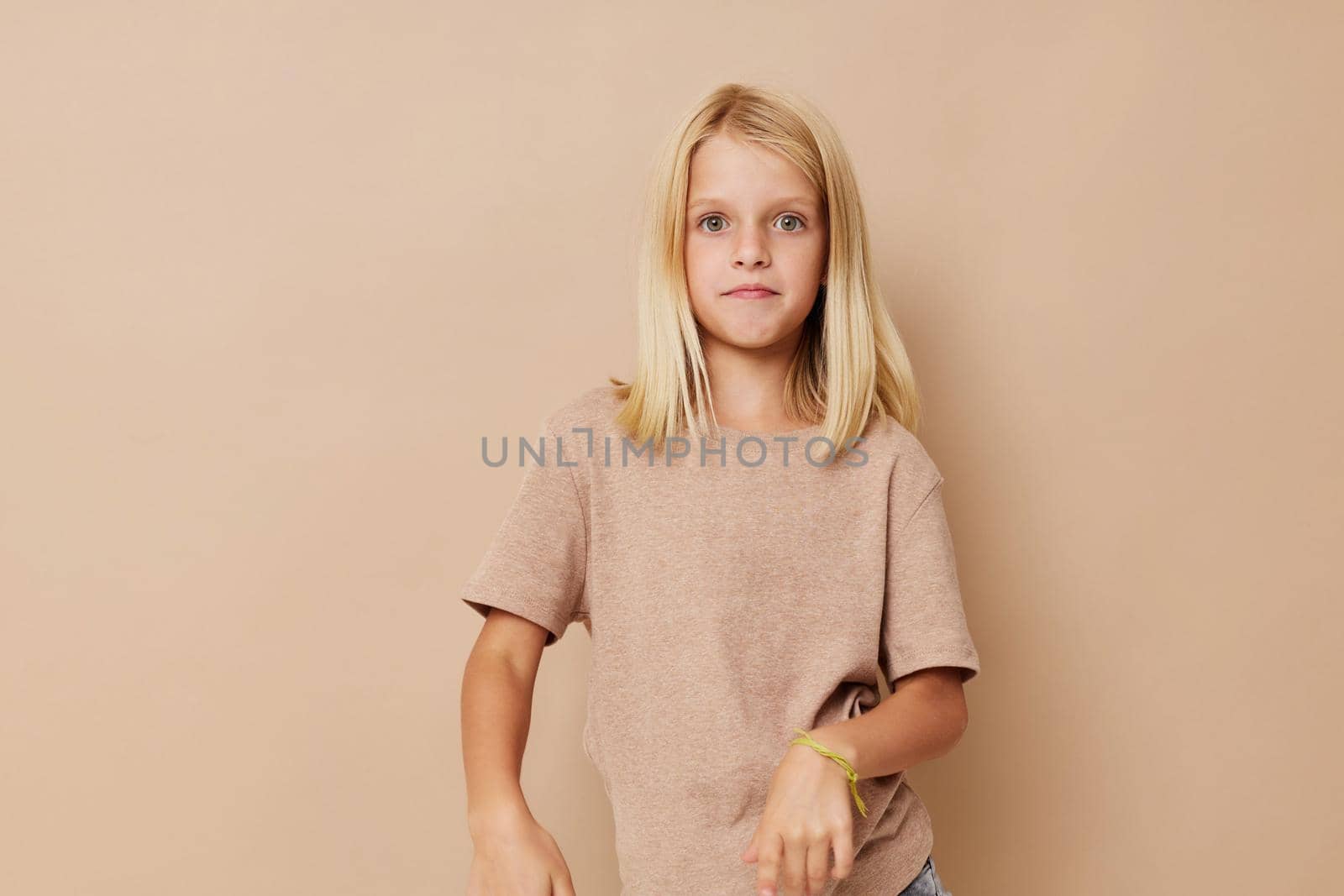 Little cute girl gestures with his hands isolated background by SHOTPRIME
