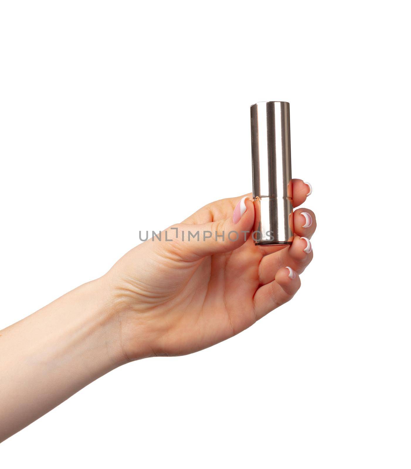 Hand holding lipsticks isolated on white background, close up.