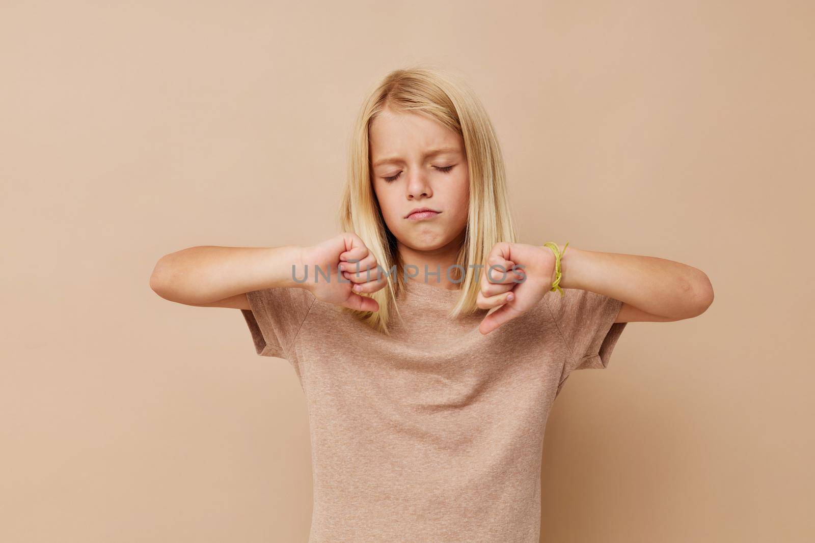 emotional girl blank space for logo design on a beige background. High quality photo