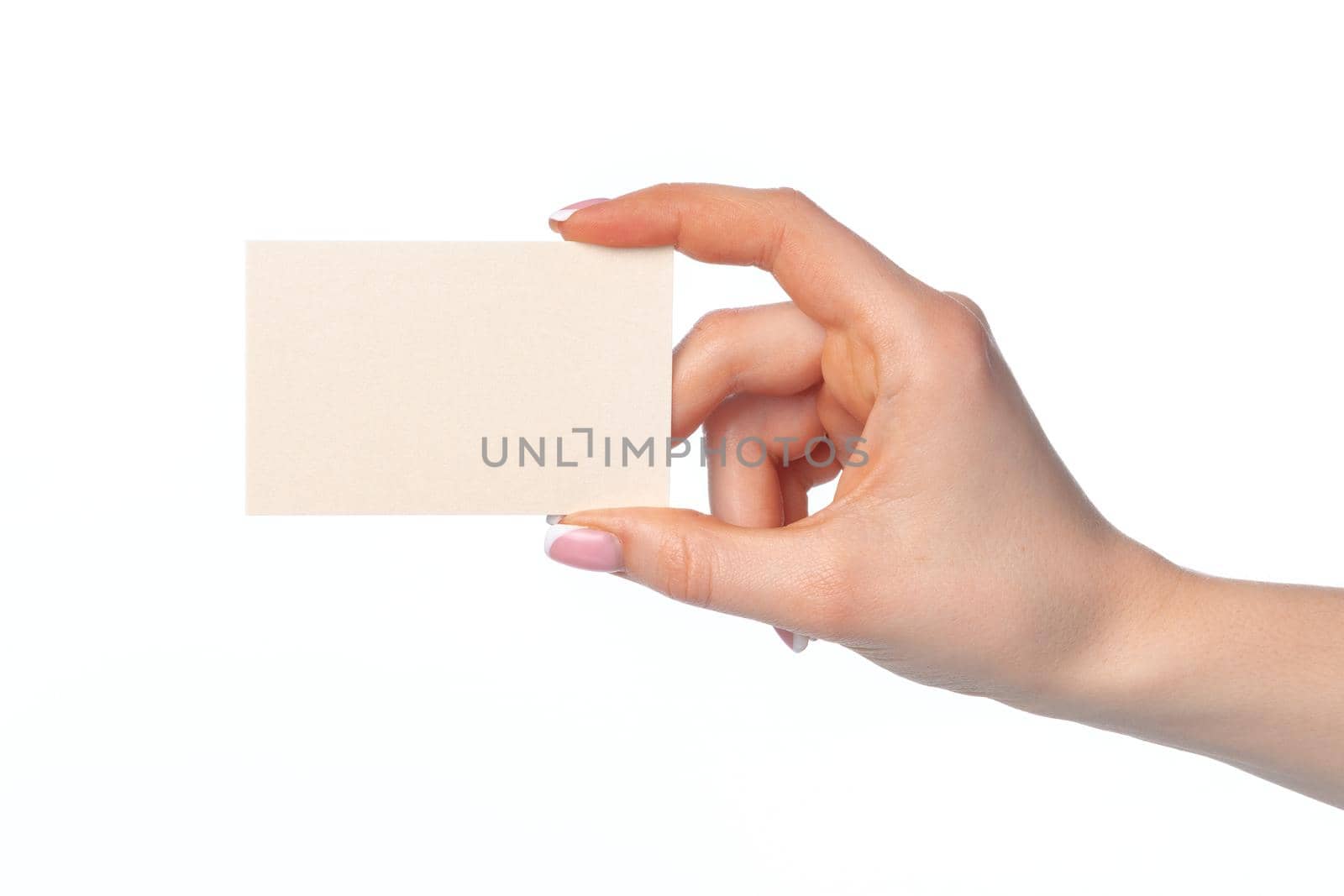 Female hand with blank white business card isolated on white background