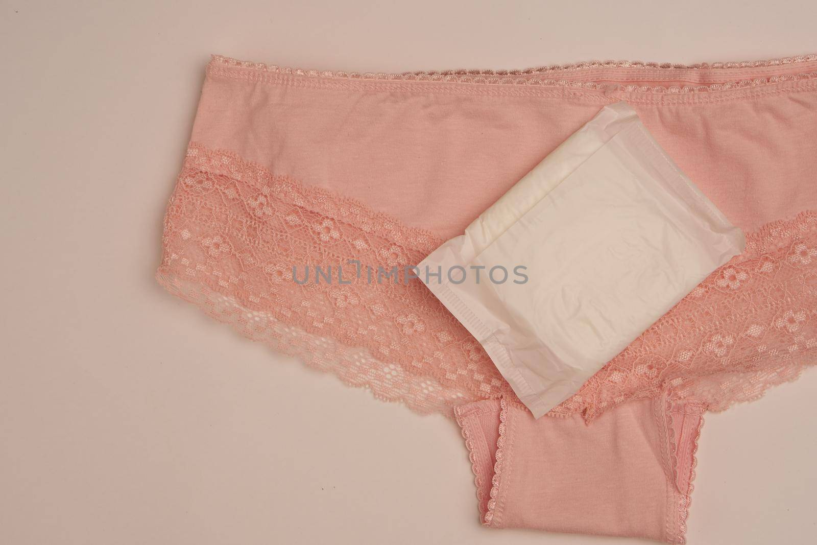 tampons pads underwear feminine hygiene protection light background. High quality photo