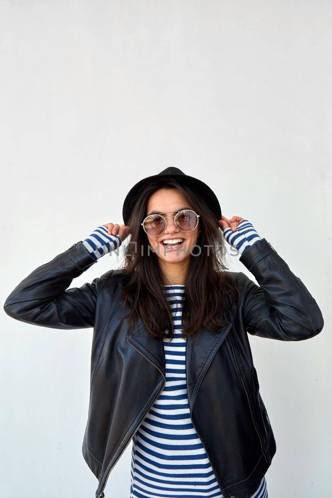 Stylish woman in leather jacket and hat by Demkat