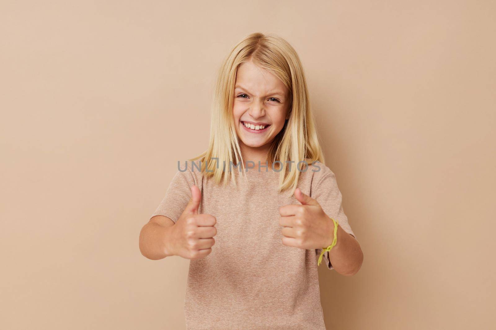 Beautiful little girl with blond hair lifestyle concept. High quality photo