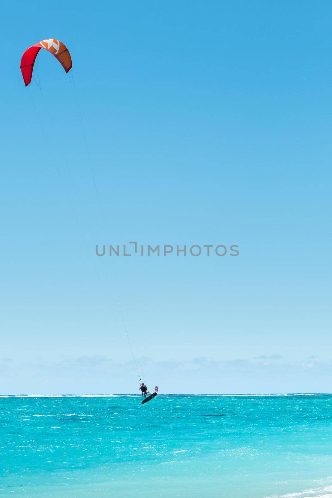A man paragliding on Le Morne beach, Mauritius, Indian ocean on the island of Mauritius by Lobachad