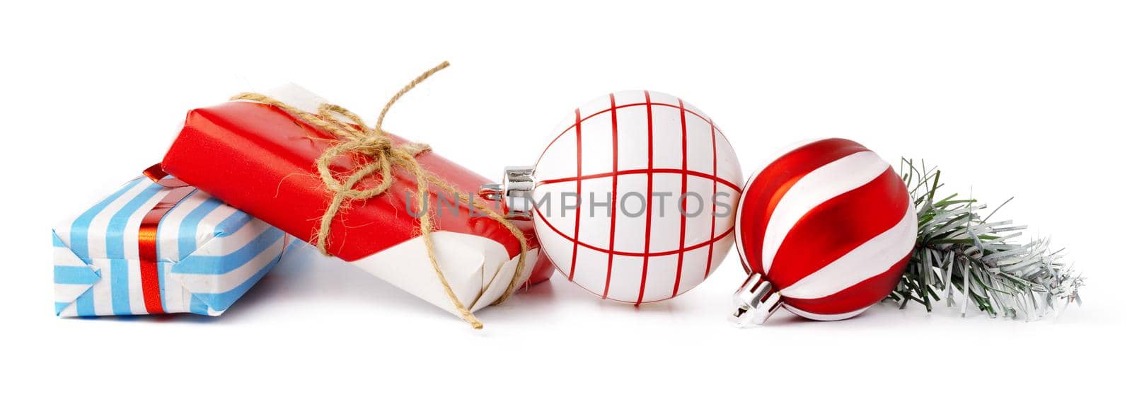 Christmas baubles and festive gift box isolated on white background by Fabrikasimf
