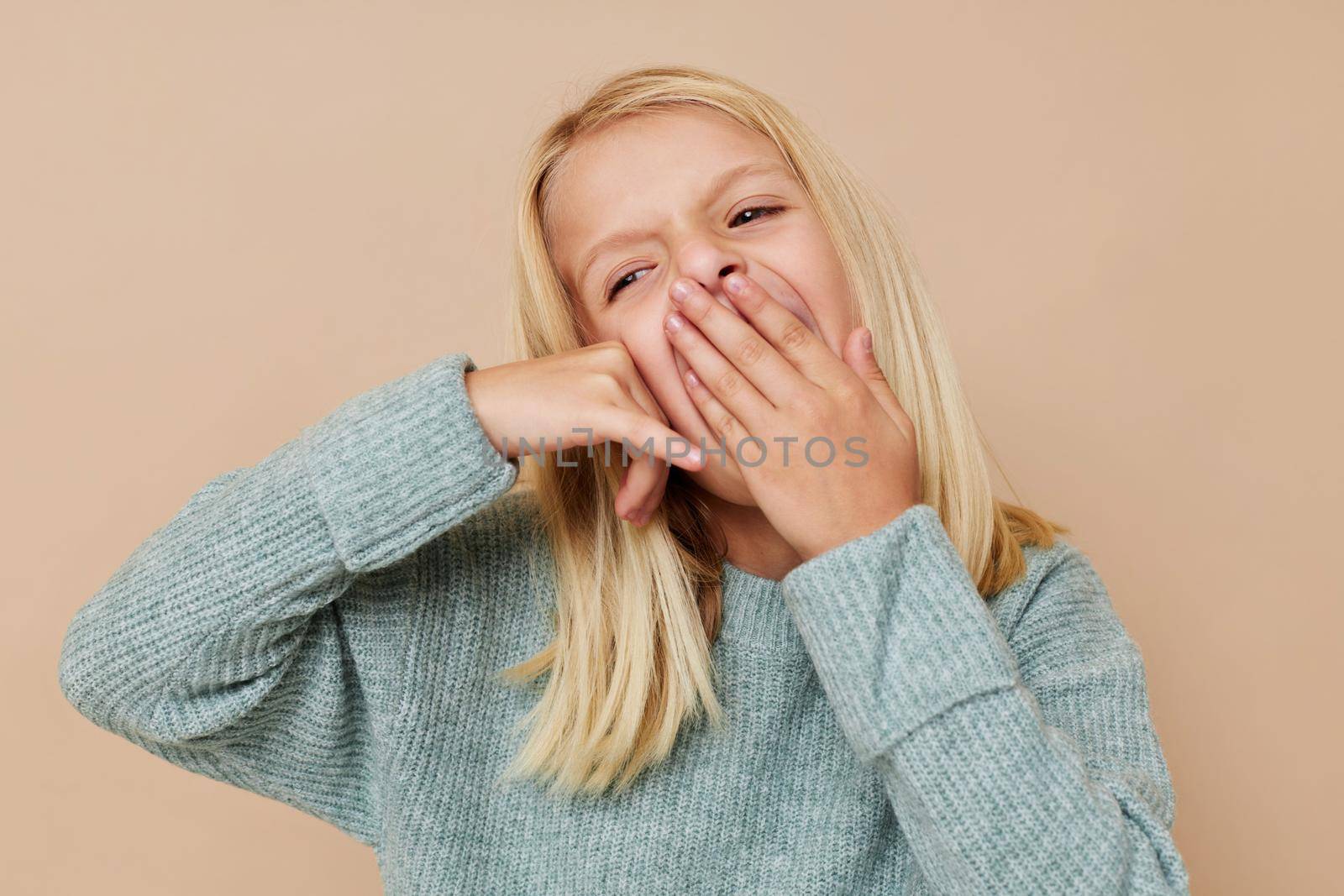 Positive little girl fashionable baby clothes posing studio by SHOTPRIME