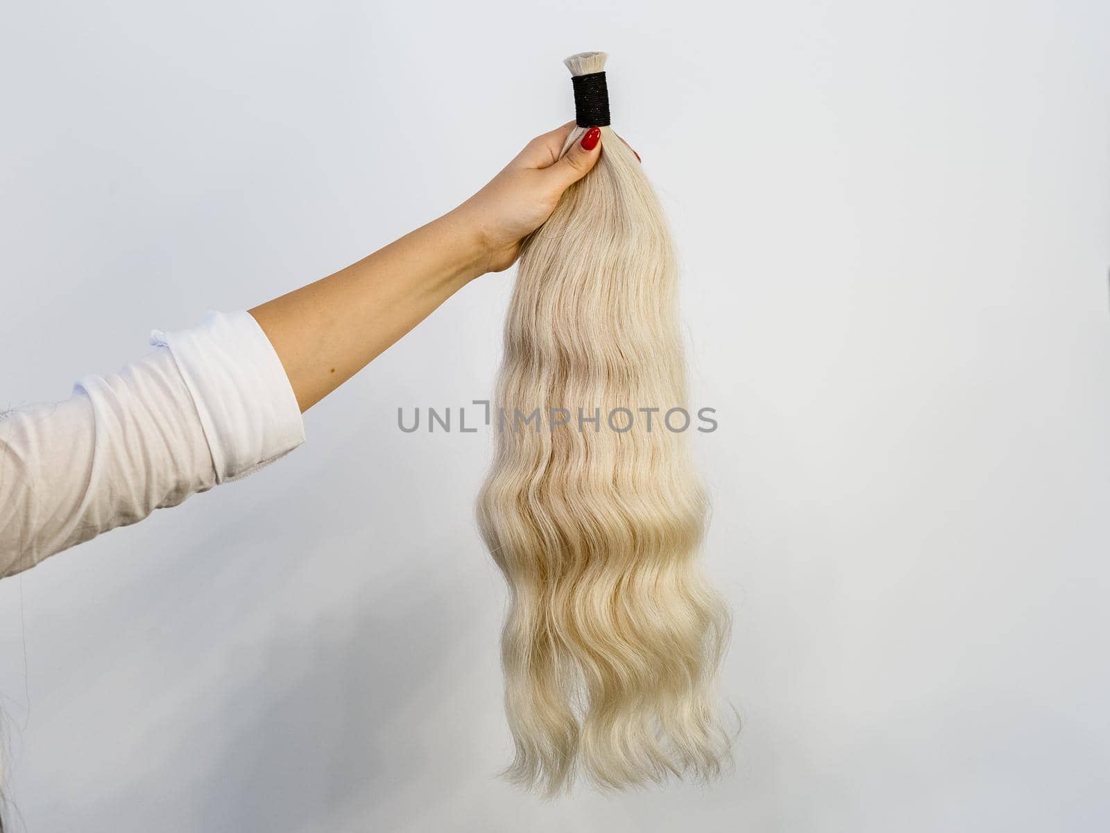 Bundle of blonde natural human hair extensions by Syvanych