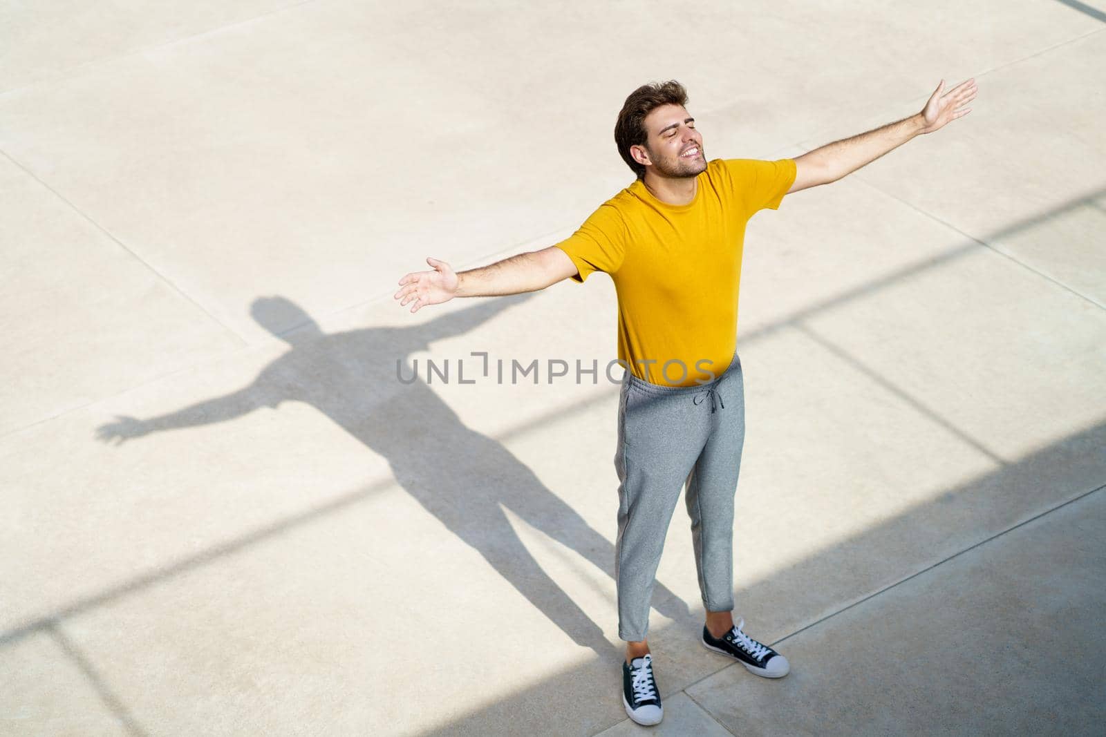 Top view of a man opening his arms by javiindy