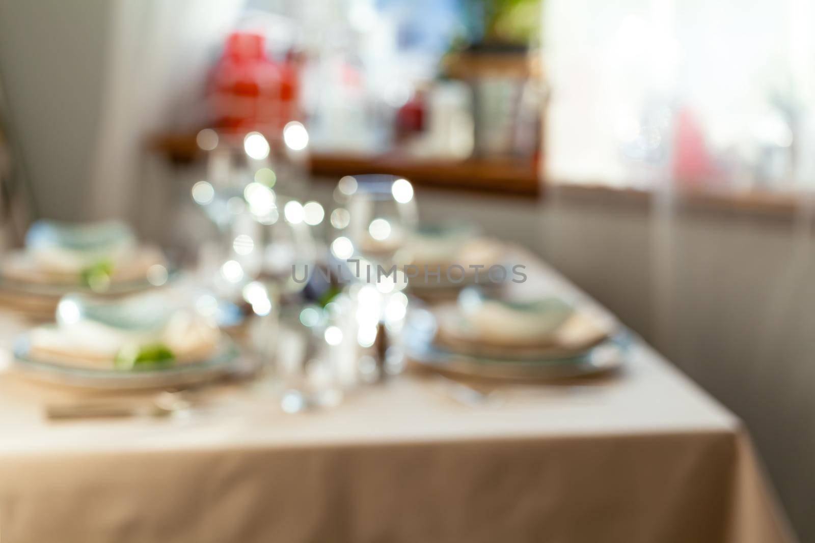 Blurred picture of an elegant table setting. Close up.