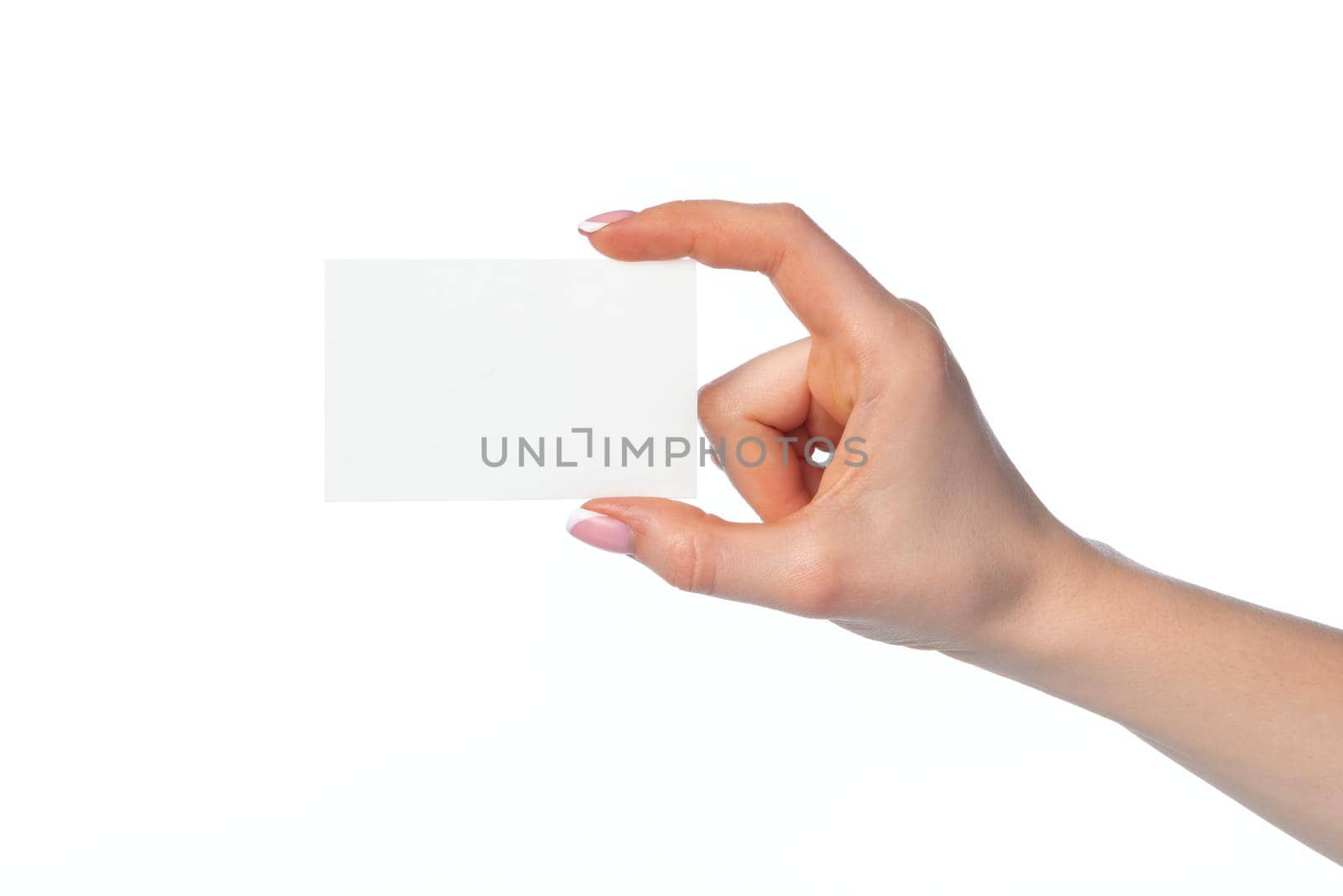 Female hand with blank white business card isolated on white background