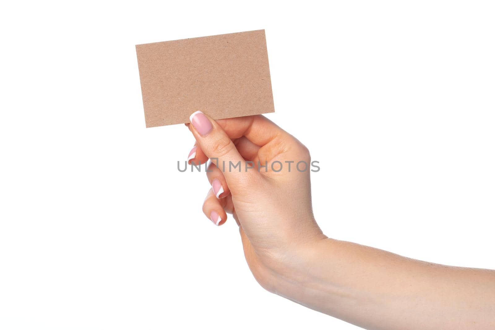 Craft paper card in female hand isolated on white background