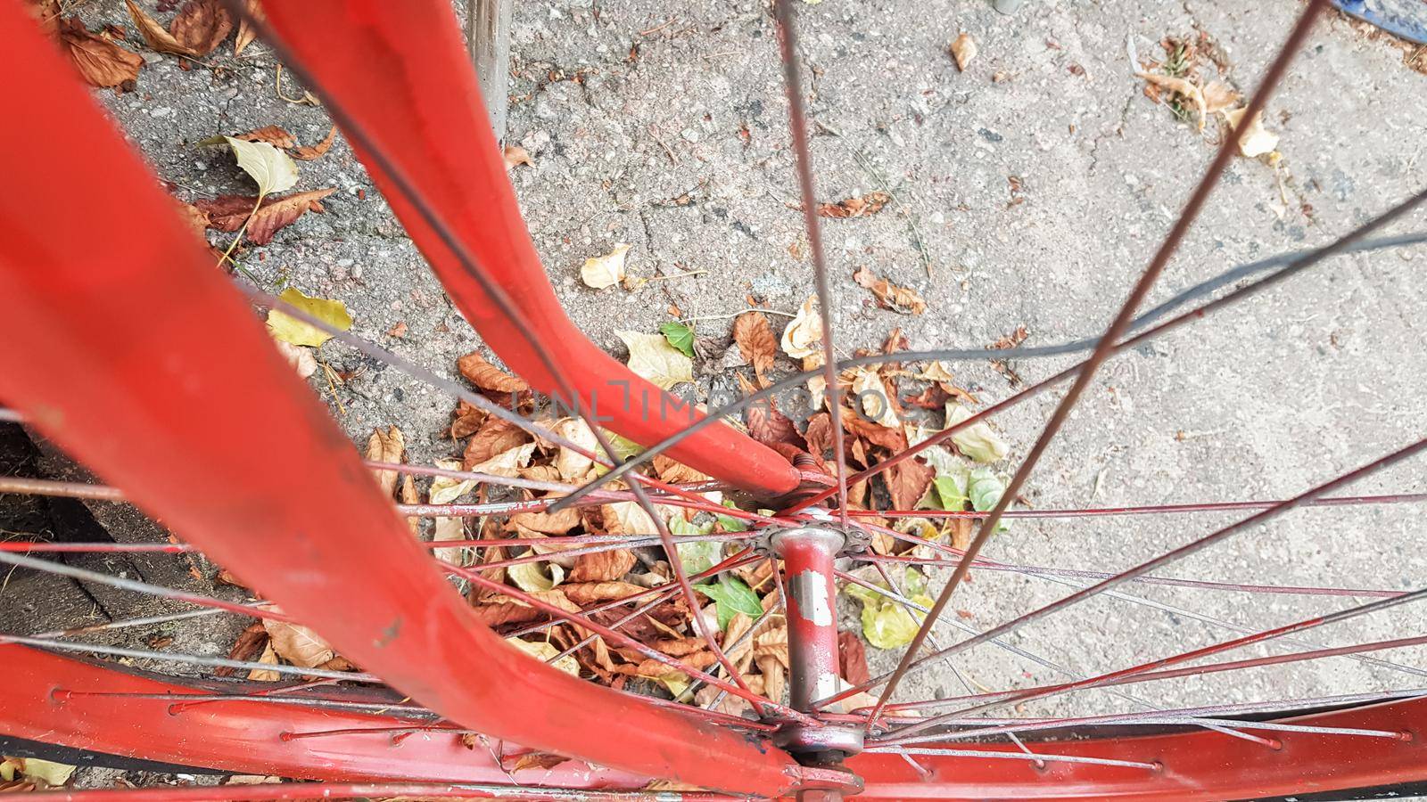 Retro vintage red bike close up. An old charming concept of a classic abandoned bike